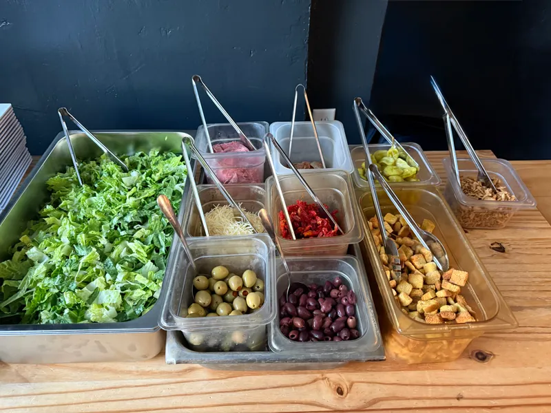 The 'Italian' salad bar at the October Monday Tasting — romaine, salami, parmesan, sun-dried tomatoes, green and kalamata olives, pepperoncini, croutons and sunflower seeds